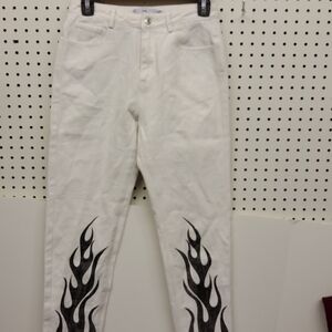 ADIKA jeans white with black flames accents lower legs.  NWOT size small